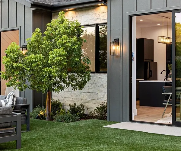 Detached backyard ADU with board-and-batten siding and glass doors, East Bay ADU construction