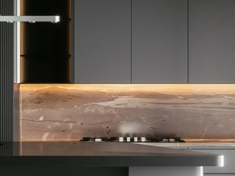 Remodeled kitchen with dark cabinetry and a lit marble backsplash, kitchen remodeling by NorCal Construction